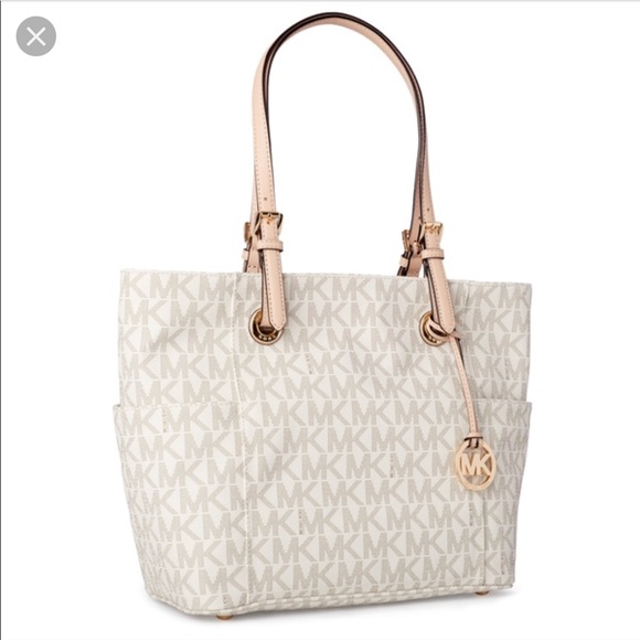 Michael Kors Handbags - AUTHENTIC Michael Kors jet set tote vanilla logo